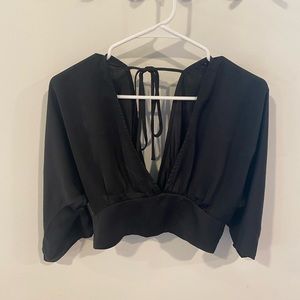 Black plunge neck top